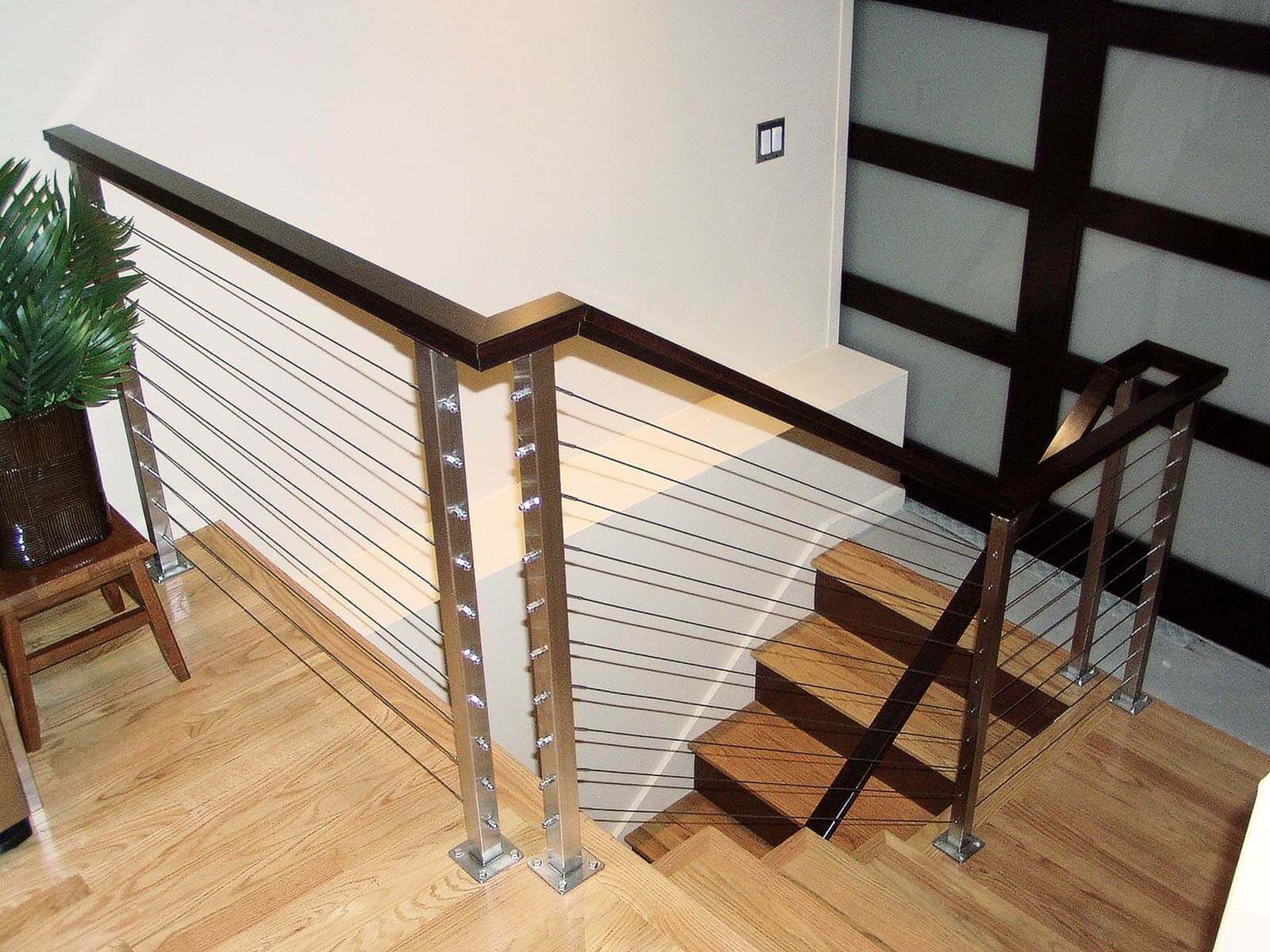 Modern design stairs leading from kitchen to multi-level living spaces.