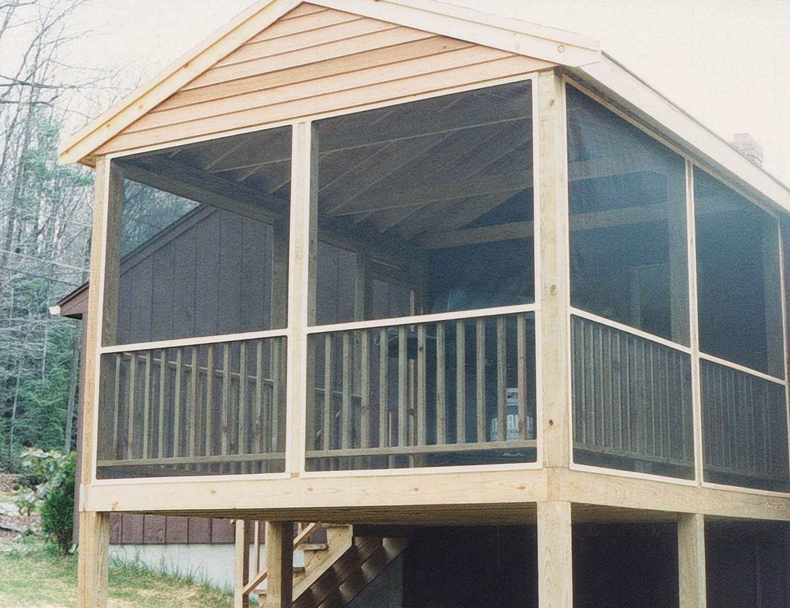 Close view of large raised screened deck.