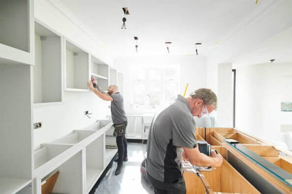 Installing a Kitchen. We hire workers who are dependable.